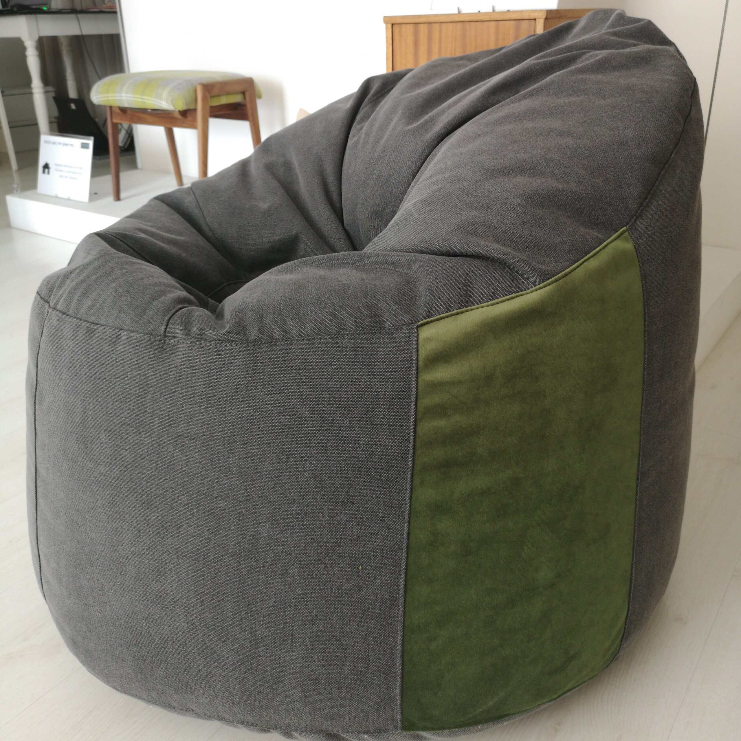 Simple, stylish, comfort bean bag in dark grey with velvet green detail