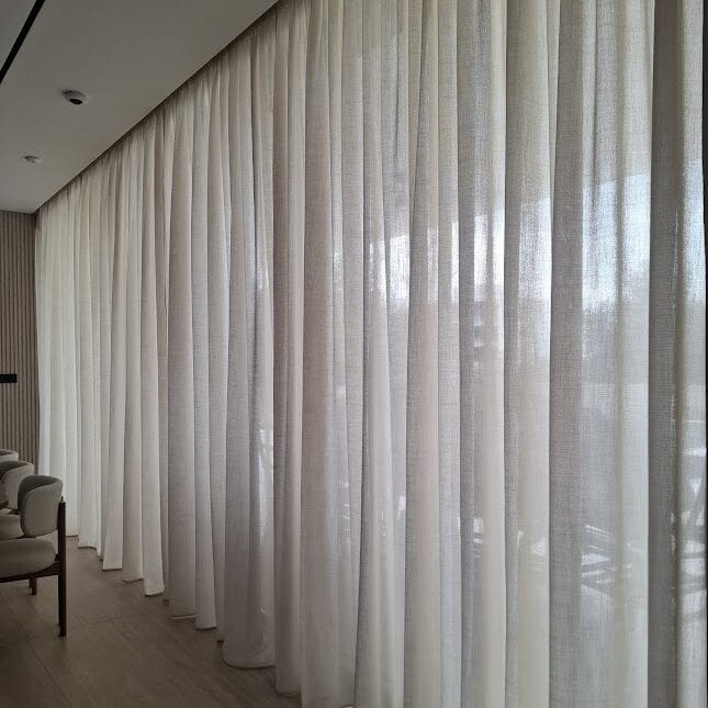 7m semi-sheer linen look curtain on a motorised rail, for a large living area