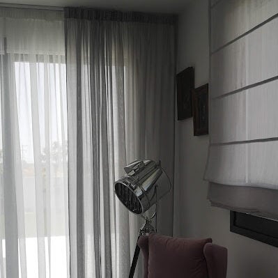 Two colours of sheers, white and grey, combined with Roman without lining