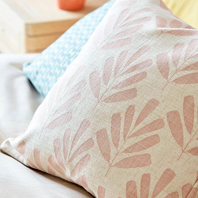 Floral patterned cushions in various colours by Scion