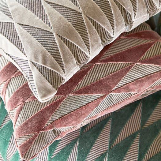 Geometric patterned cushions in various colours by Harlequin