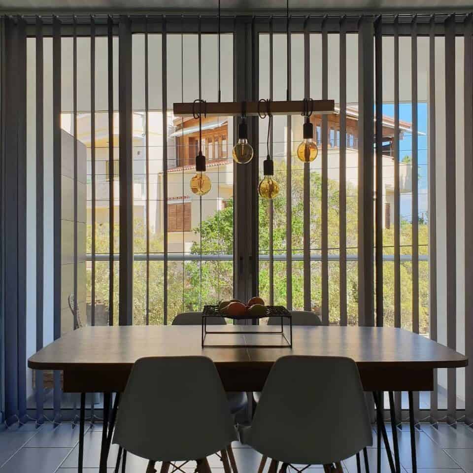 Dark grey floor-length vertical blind