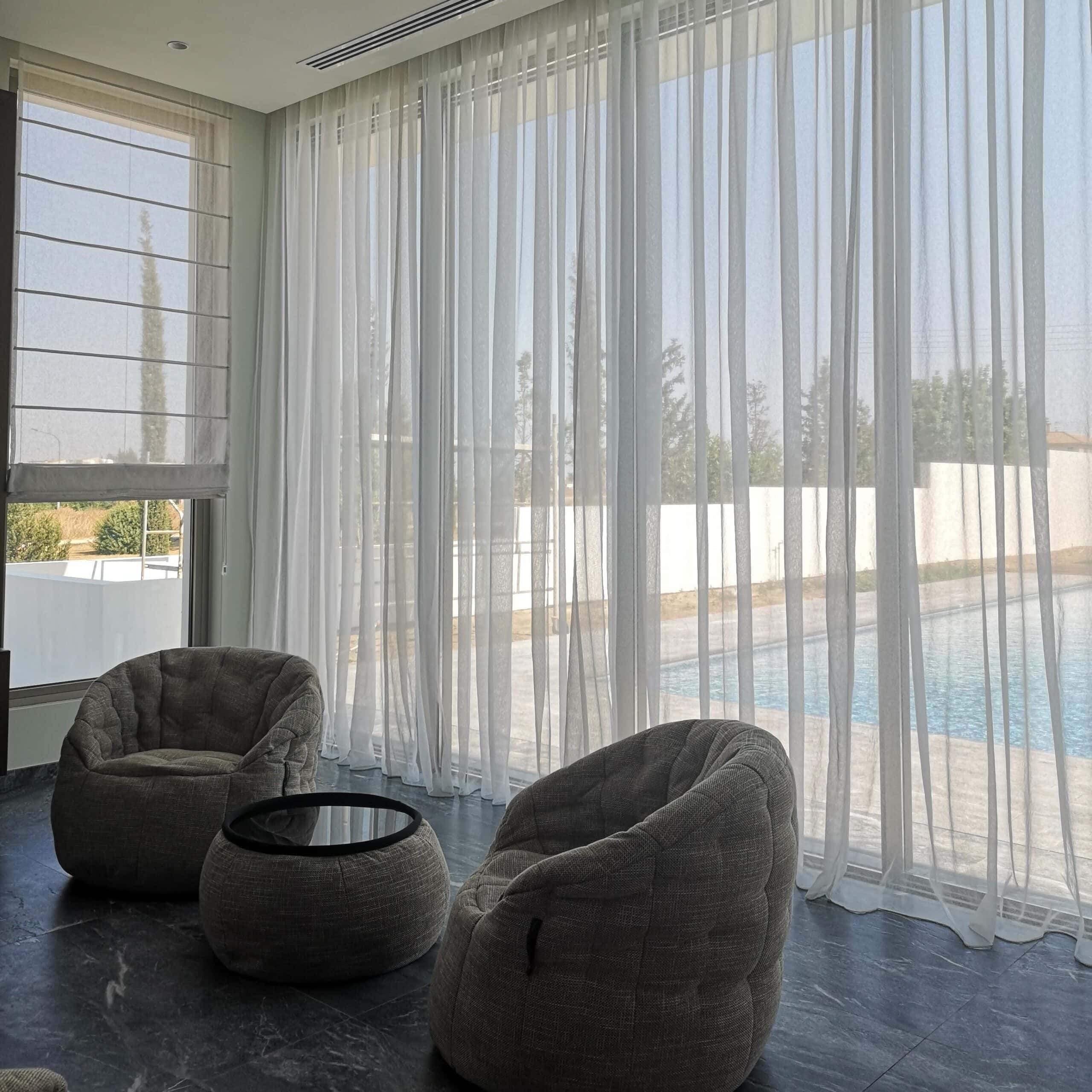 White textured pencil pleat sheer curtains to allow natural light