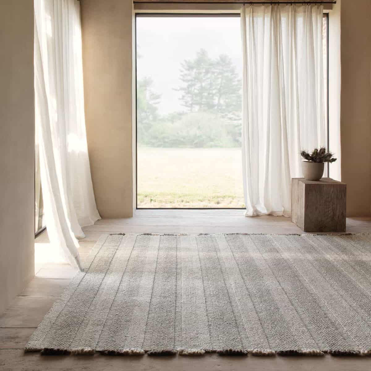 'GRADE' handwoven rug by Ligne Pure. See full catalogue in store