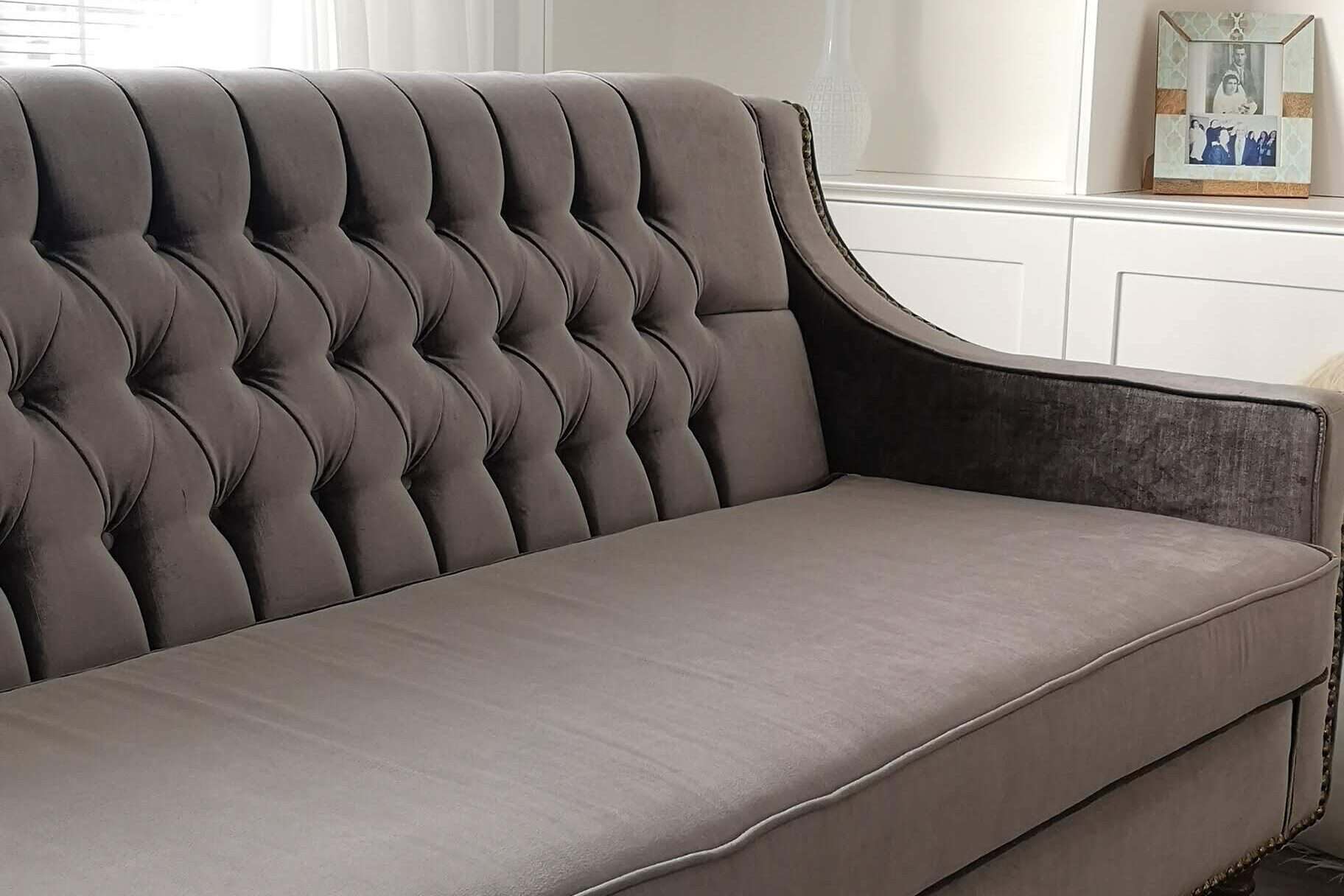 a custom-buttoned classic style with modern finishes sofa
