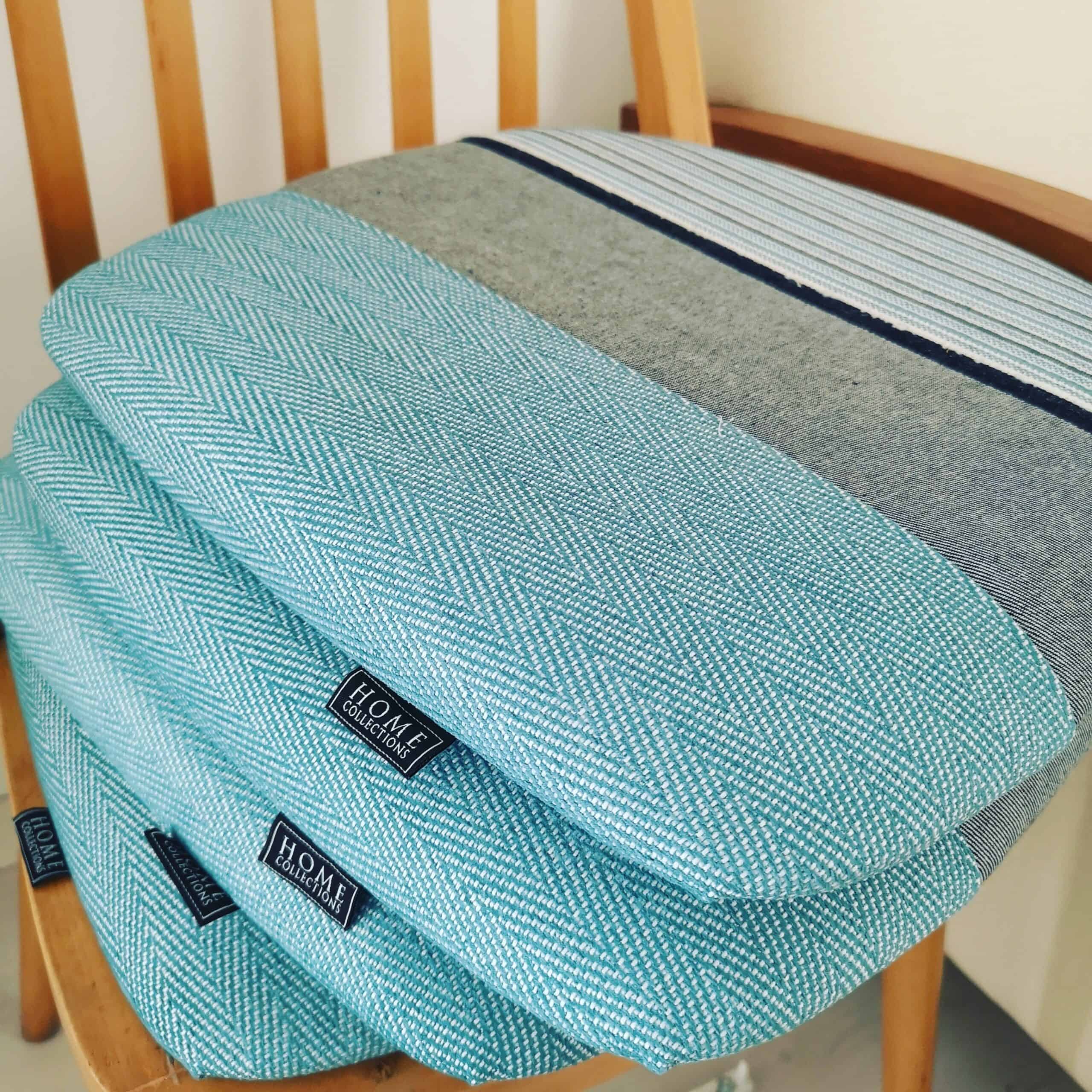 Dining chairs, seat reupholstery with three different fabrics & trimming detail