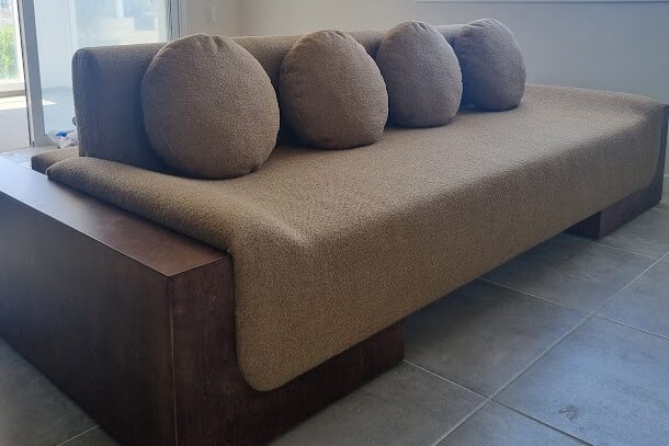 a custom double-sided sofa with unique rounds cushions