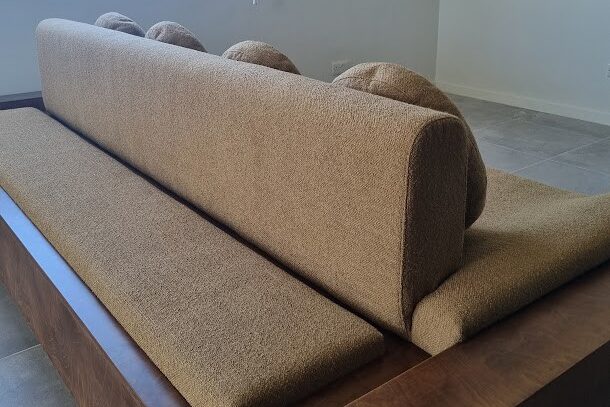 a custom double-sided sofa with unique rounds cushions