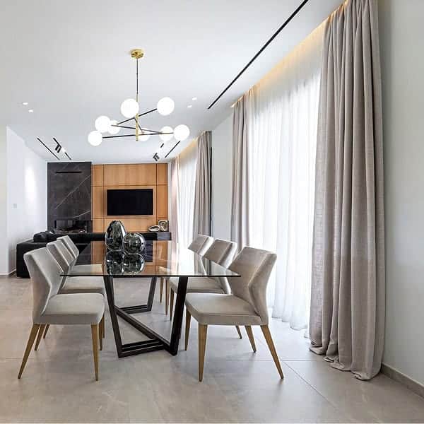 Double ceiling rails with white sheer curtains and beige drapes. Pooling 15cm