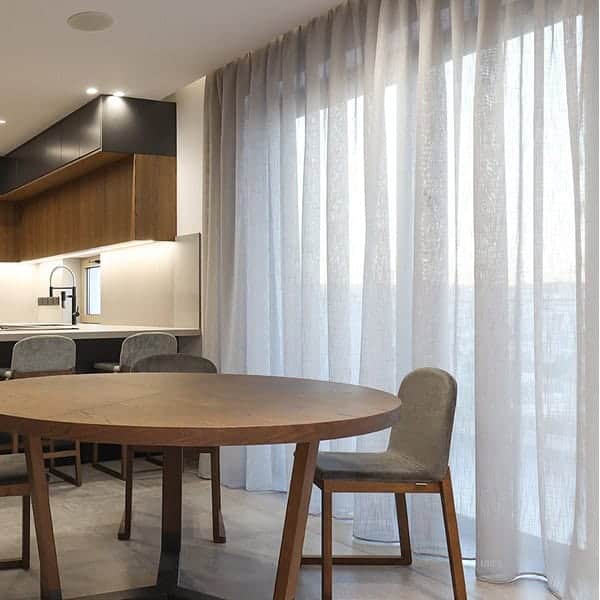 Linen look, double pencil pleat sheer curtains, allowing natural light